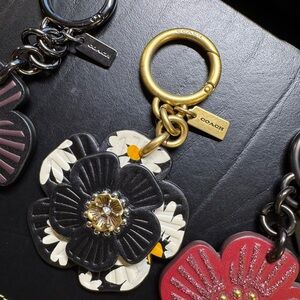 Coach Black and Gold daisy tea rose Floral Keychain